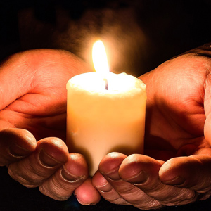 Candle in hands